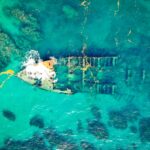 old rusty boat deteriorating in a turquoise water
